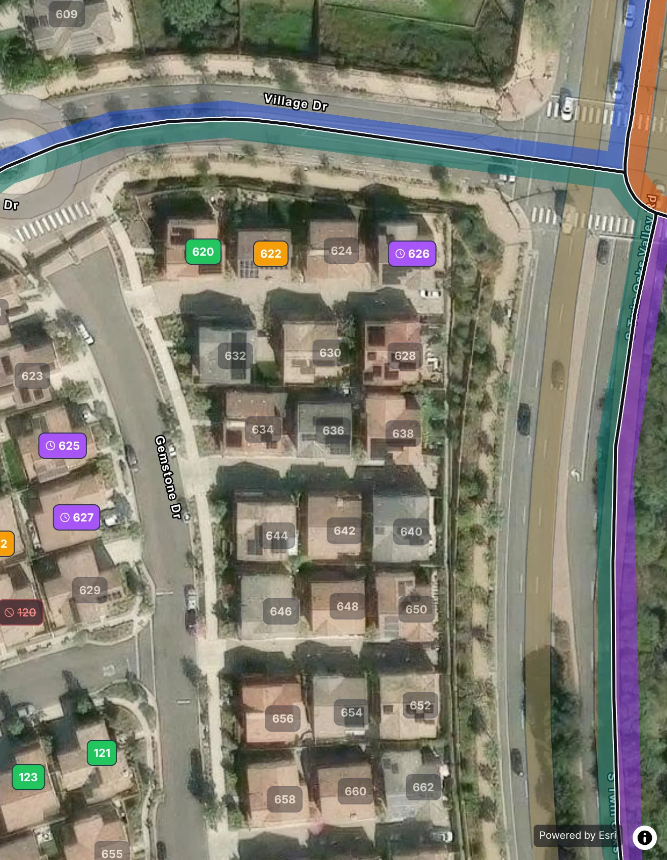 One street in San Marcos on satellite: every home its own numbered door, the knocked ones colored by what happened