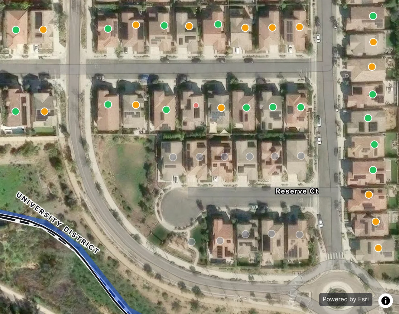 Homes on one San Marcos street on satellite, each door a dot colored by what happened